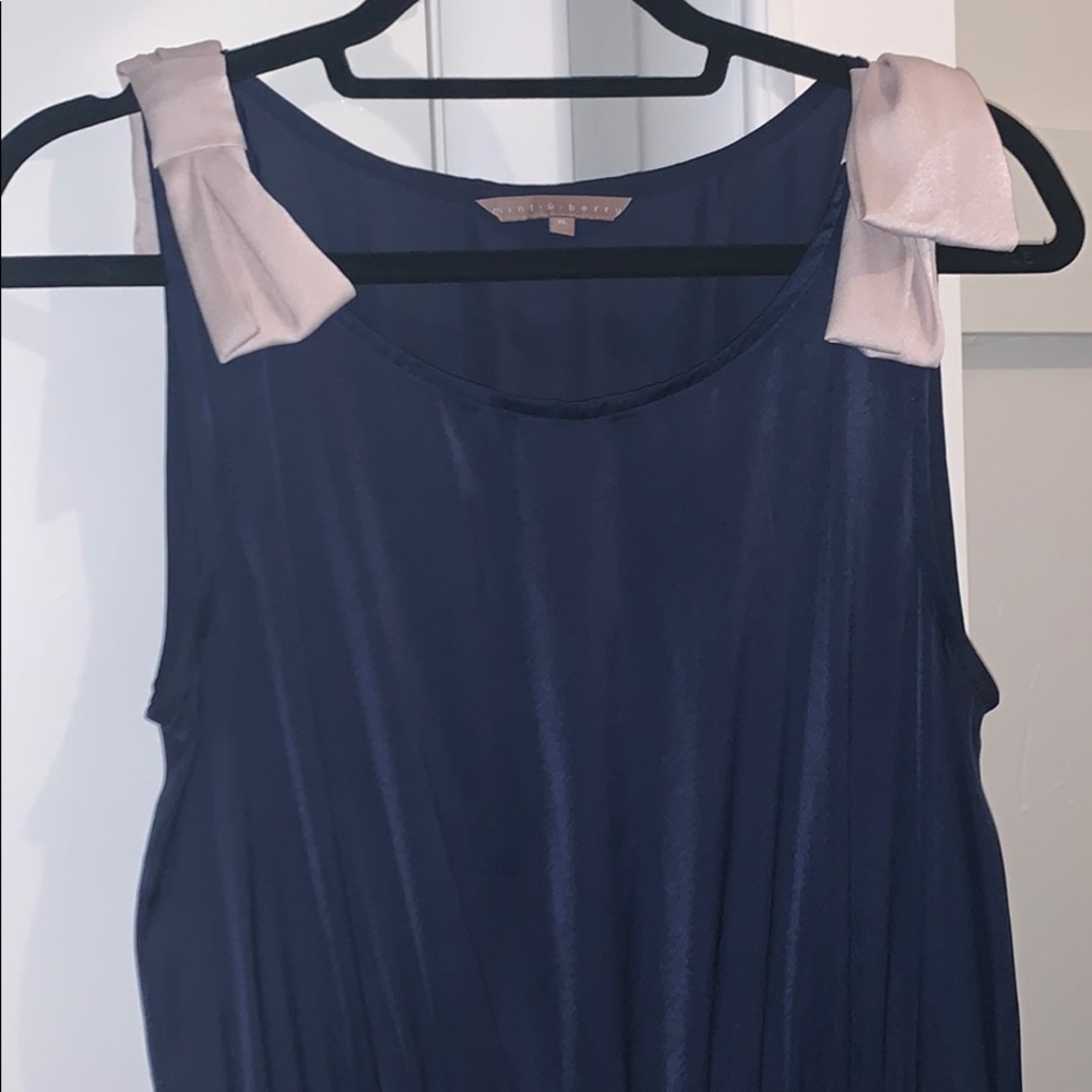 Blue satin dress with bow accents
